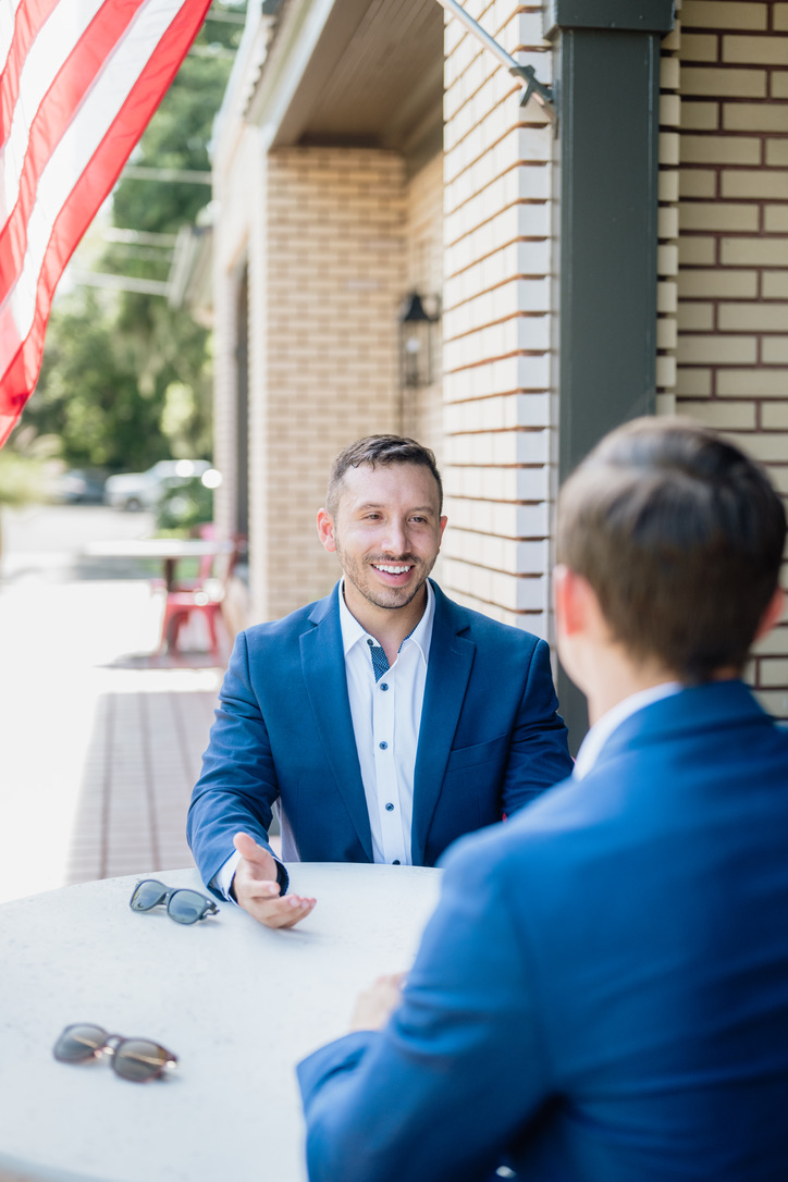 Tony meeting a client at a café