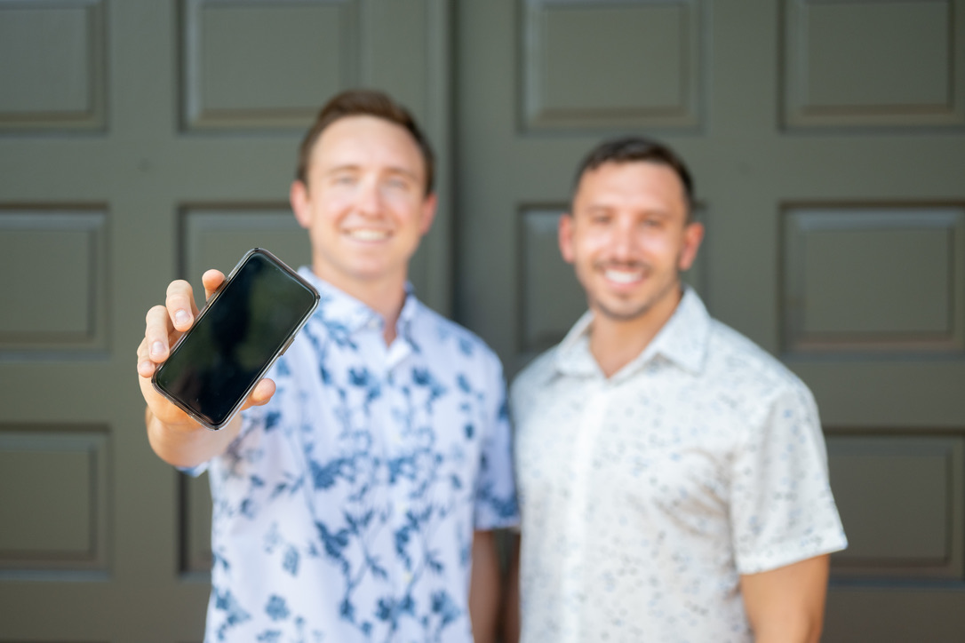 Tony and colleague with phone